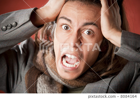 Handsome Young Man Screaming 8084164