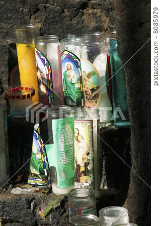 Devotional candles on an outdoor altar 8085979