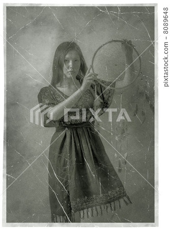 Indian squaw girl in traditional Indian wear posing to the camera. 8089648