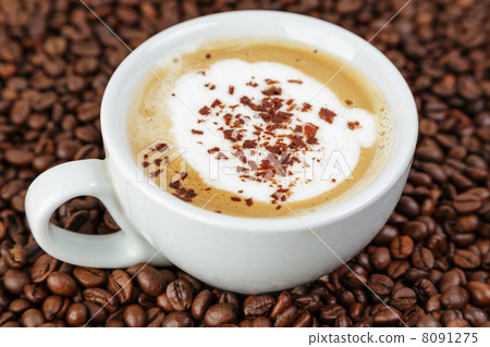 cappucino in cup on coffee beans 8091275