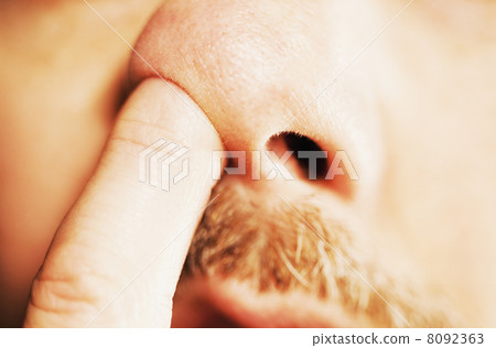 Man's finger in nose Man's finger in nose 8092363