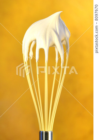 Whisk with whip cream on top 8097670