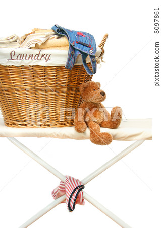 Teddy bear with laundry basket on ironing board Teddy bear with laundry basket on ironing board 8097861