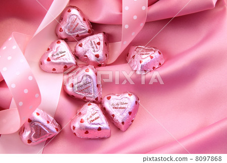 Valentines chocolate hearts on pink satin Valentines chocolate hearts on pink satin 8097868