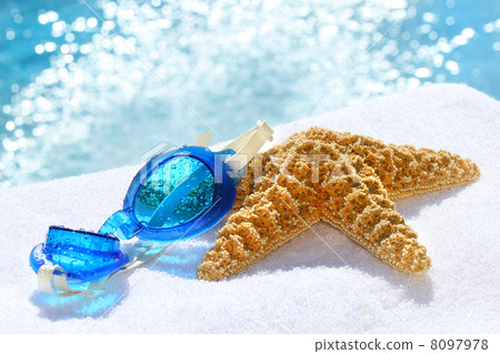 Blue goggles on a white towel 8097978