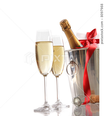 Glasses of champagne with red ribbon gift Glasses of champagne with red ribbon gift 8097988