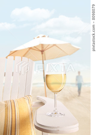 Glass of wine on adirondack chair at the beach Glass of wine on adirondack chair at the beach 8098079