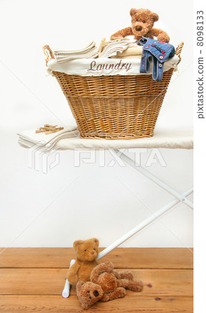 Laundry basket with teddy bears on floor Laundry basket with teddy bears on floor 8098133