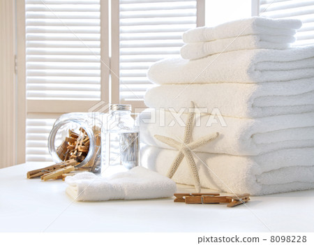 Fluffy white towels on table Fluffy white towels on table 8098228