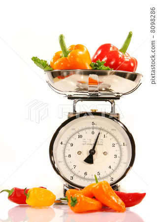 Colored peppers on white background Colored peppers on white background 8098286