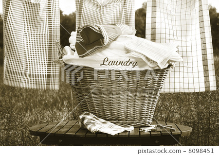 Laundry basket on rustic table 8098451