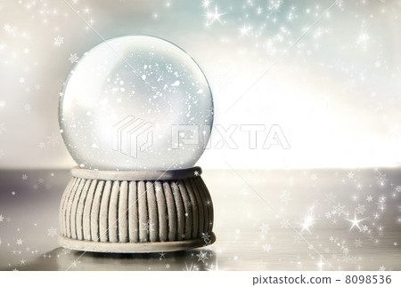 Snow globe against a silver background Snow globe against a silver background 8098536