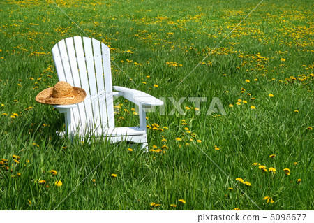White chair with straw hat White chair with straw hat 8098677