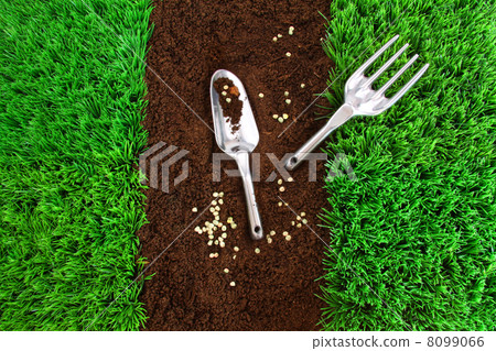 Garden tools on earth 8099066