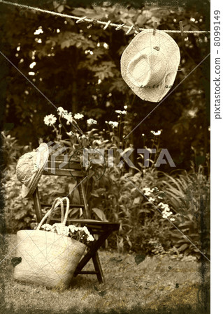 Straw hat hanging on clothesline 8099149