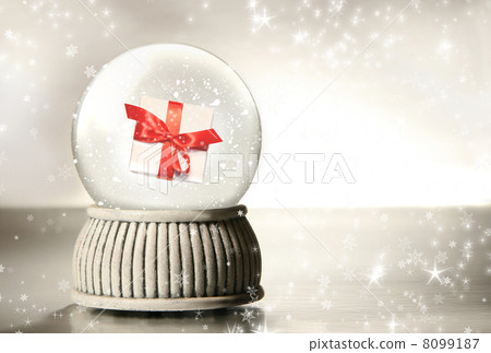 Snow globe against a silver background Snow globe against a silver background 8099187