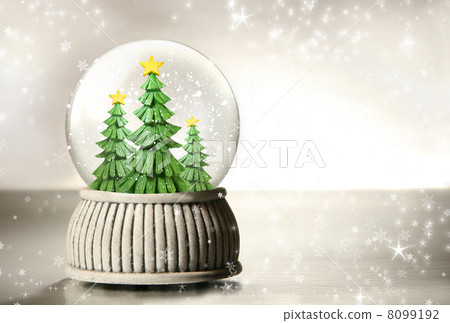 Snow globe against a silver background Snow globe against a silver background 8099192