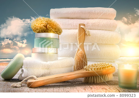 White towels with bath asessories at the beach White towels with bath asessories at the beach 8099323