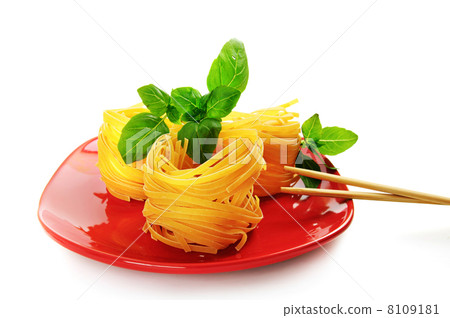 Pasta nests on a dish 8109181
