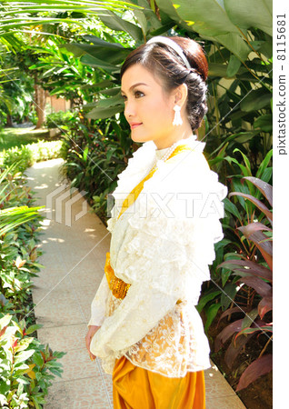 A young woman wearing a Thai dress A young woman wearing a Thai dress 8115681