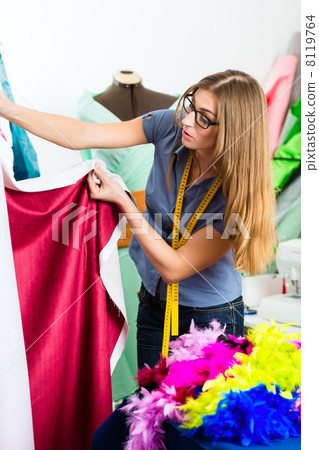 Fashion designer or tailor working in studio Fashion designer or tailor working in studio 8119764