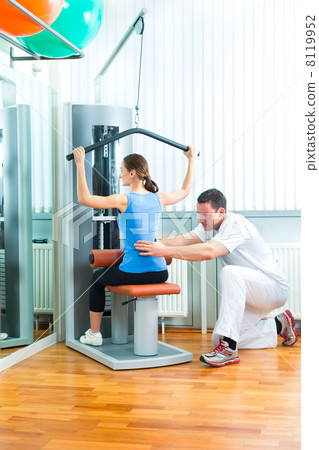 Patient at the physiotherapy doing physical therapy 8119952