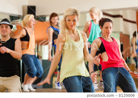 Zumba or Jazzdance - young people dancing in studio 8120006