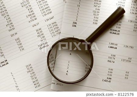 Operating budget and magnifying glass 8122576