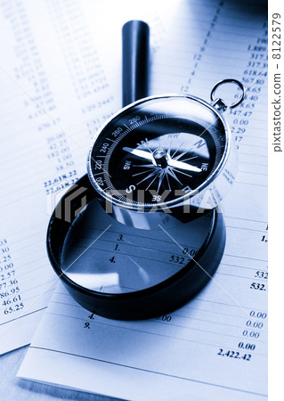 Operating budget, magnifying glass and black compass Operating budget, magnifying glass and black compass 8122579