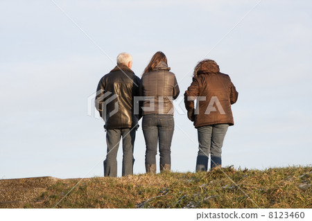 Three people on a Dutch dike 8123460