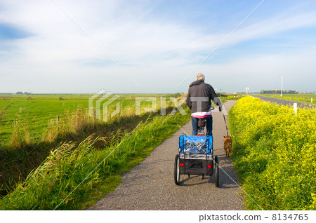 Man with his dog at the bike Man with his dog at the bike 8134765