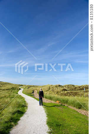 Man is walking in coast landscape 8135180