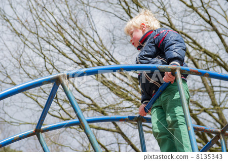 Child playing in playgarden 8135343