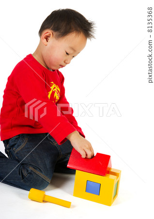 Chinese boy playing with toys 8135368