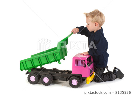 Little child playing with a truck Little child playing with a truck 8135526