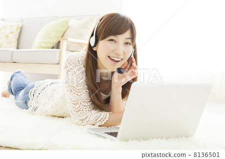 A woman relaxing in the room A woman relaxing in the room 8136501