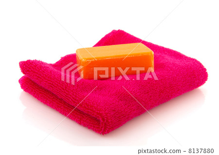 Folded pink towel with soap bar Folded pink towel with soap bar 8137880