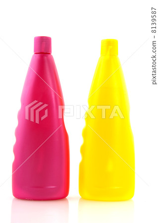 Pink and yellow shampoo bottles Pink and yellow shampoo bottles 8139587