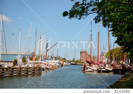 Village in Holland with harbor and castle 8142080