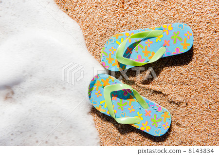 Flip flops at the beach Flip flops at the beach 8143834