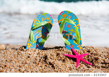 Flip flops at the beach Flip flops at the beach 8143947