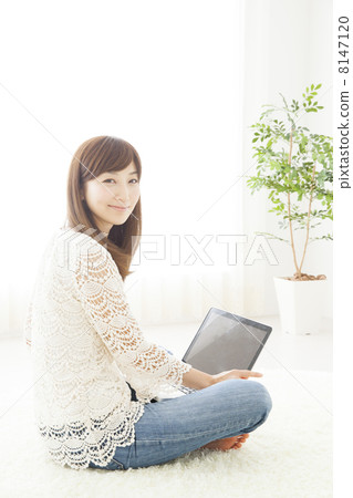 A woman relaxing in the room A woman relaxing in the room 8147120