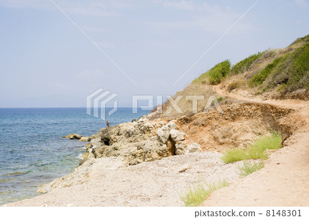 Greek coast with fisherman 8148301