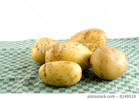 Potatoes on a green tea-cloth Potatoes on a green tea-cloth 8149528