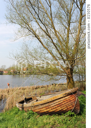 Rowing boat near the river Rowing boat near the river 8150576