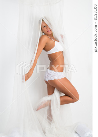 Tanned girl in lingerie on the bed Tanned girl in lingerie on the bed 8153100