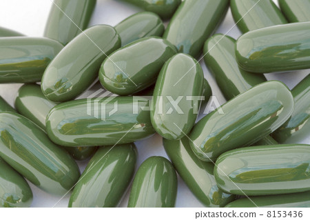green gelatinous capsules background 8153436