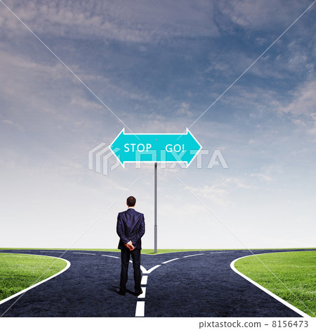 Businessman at crossroads 8156473