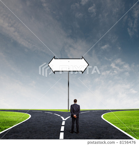 Businessman at crossroads 8156476