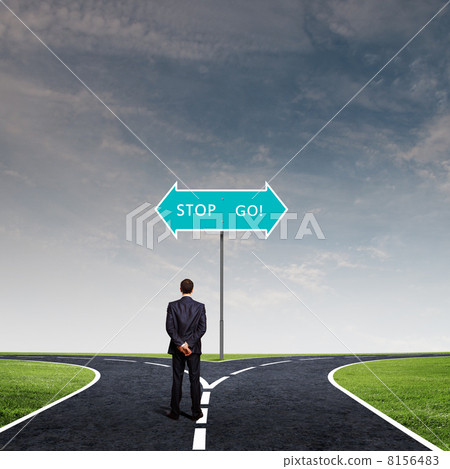 Businessman at crossroads Businessman at crossroads 8156483